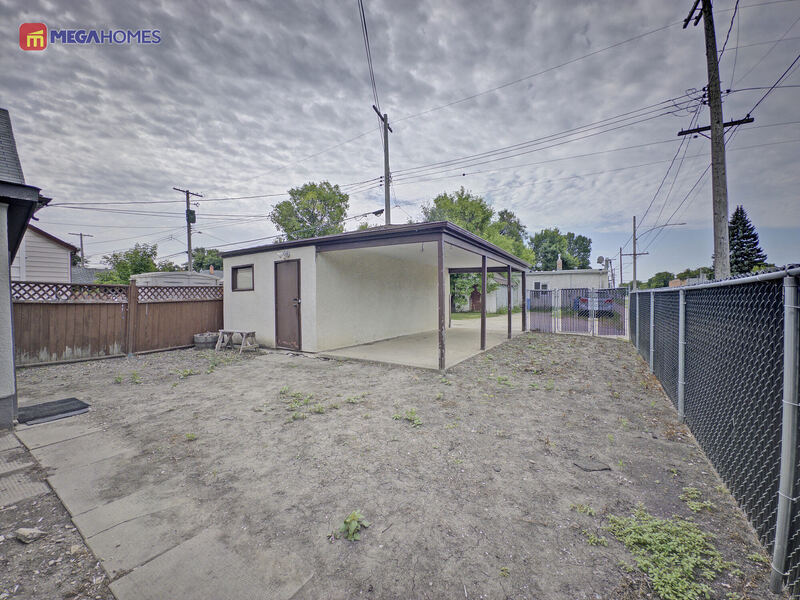 Detached garage exterior with carport