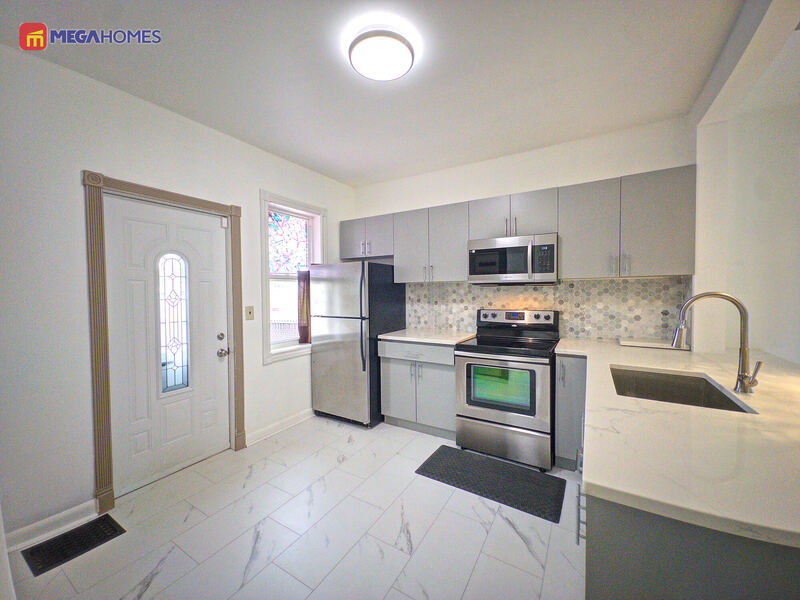 Open kitchen and dining area with pendant lighting